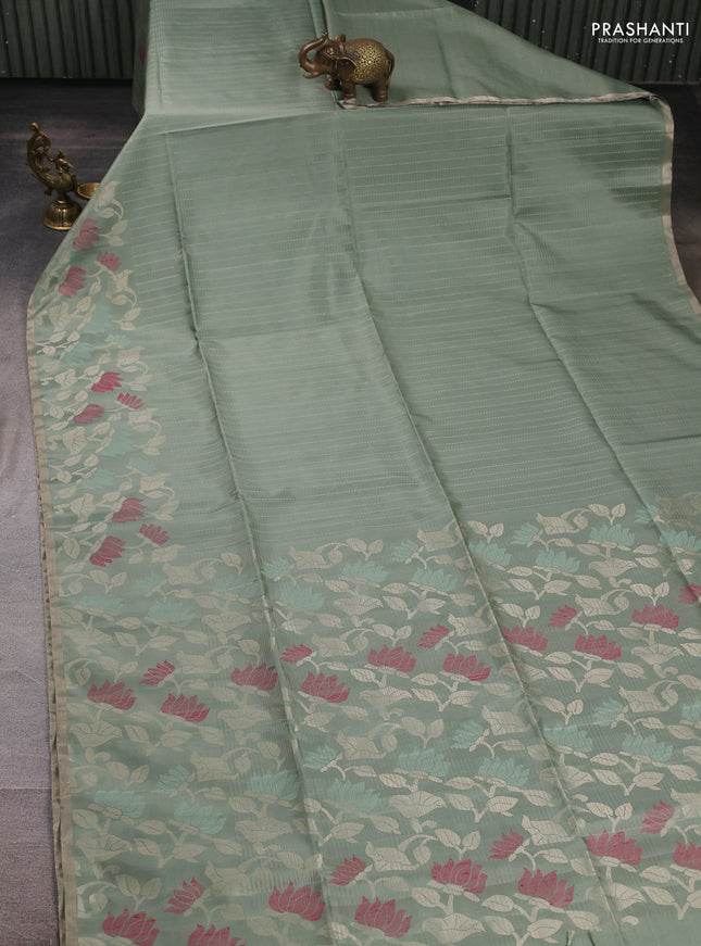 Pure soft silk saree pastel green with allover zari stripe pattern and floral zari woven border