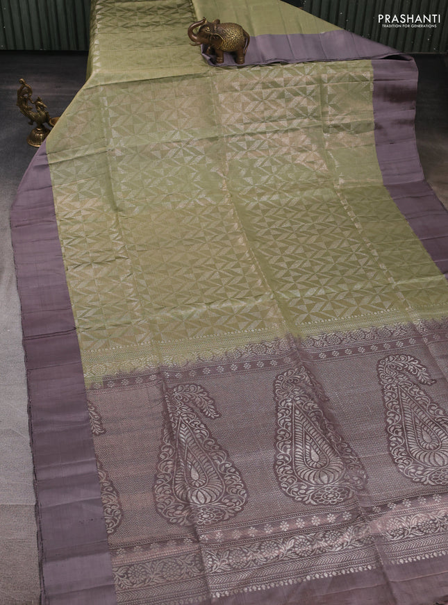 Pure soft silk saree elaichi green and grey shade with allover zari woven brocade weaves and simple border