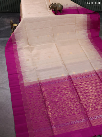 Pure soft silk saree cream and magenta pink with allover zari weaves and zari woven simple border