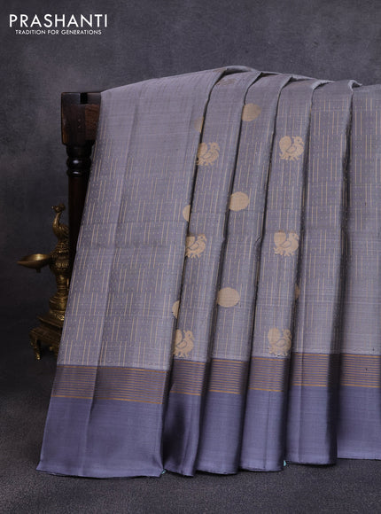 Pure soft silk saree grey with allover zari weaves and zari woven simple border