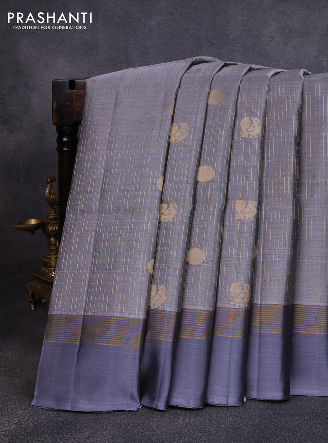 Pure soft silk saree grey with allover zari weaves and zari woven simple border