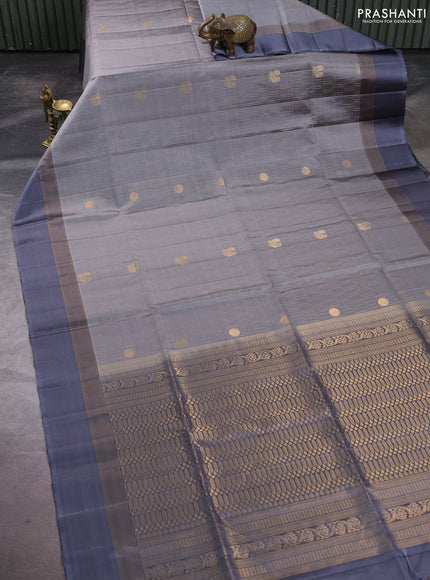 Pure soft silk saree grey with allover zari weaves and zari woven simple border