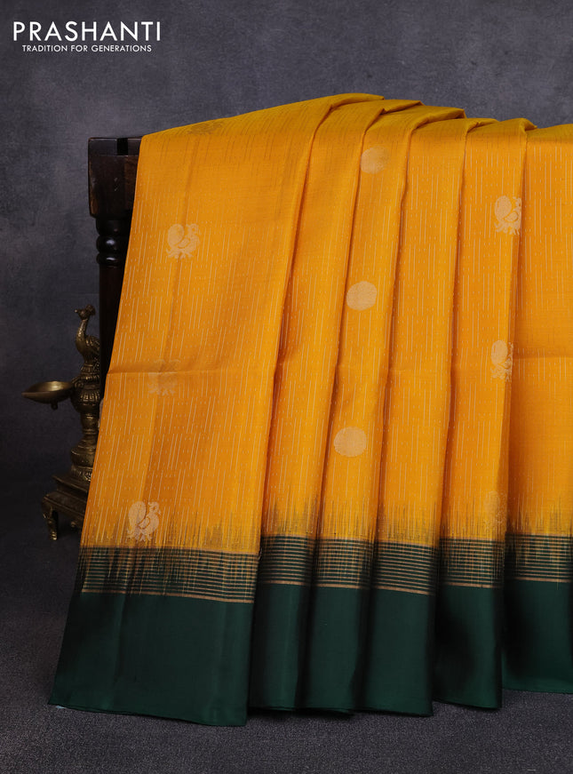 Pure soft silk saree yellow and bottle green with allover zari weaves and zari woven simple border