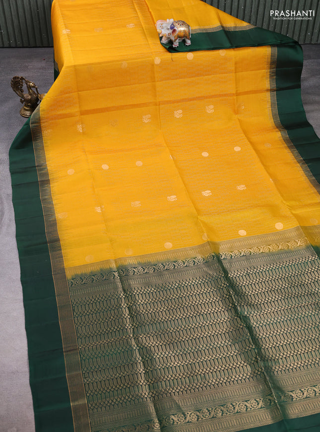 Pure soft silk saree yellow and bottle green with allover zari weaves and zari woven simple border