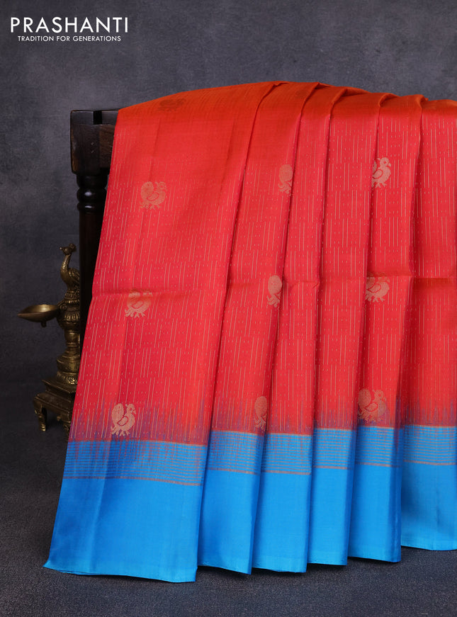 Pure soft silk saree dual shade of pinkish orange and light blue with allover zari weaves and zari woven simple border