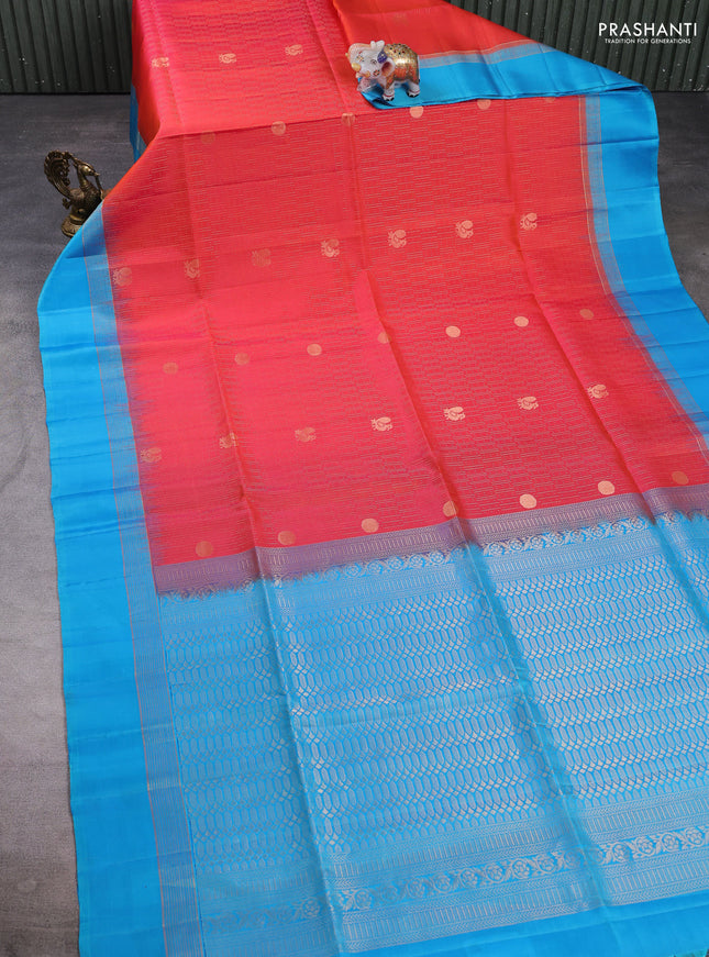 Pure soft silk saree dual shade of pinkish orange and light blue with allover zari weaves and zari woven simple border
