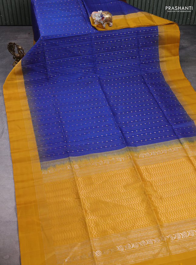 Pure soft silk saree blue and mustard yellow with allover zari weaves and zari woven simple border