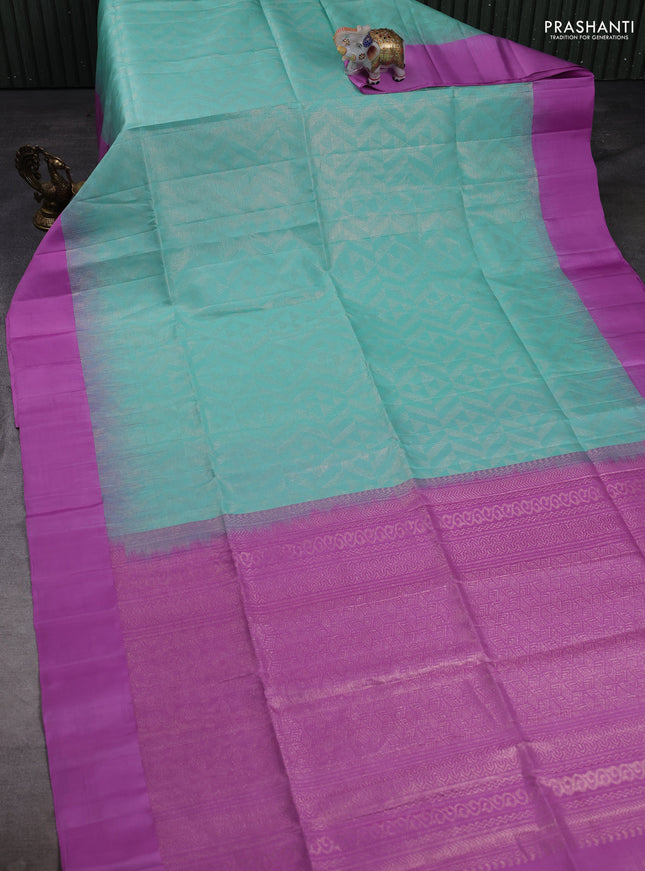 Pure soft silk saree teal blue and lavender with allover zari woven brocade weaves and simple border