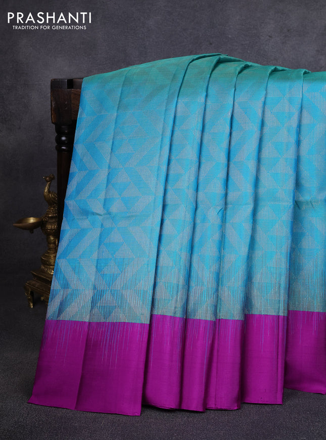 Pure soft silk saree dual shade of teal blue and purple with allover zari woven brocade weaves and simple border