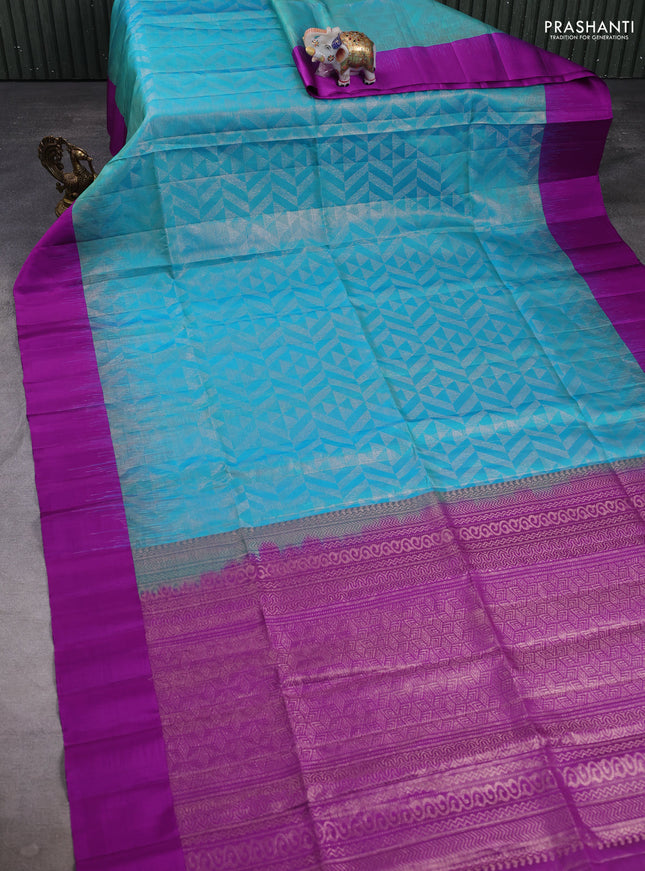 Pure soft silk saree dual shade of teal blue and purple with allover zari woven brocade weaves and simple border