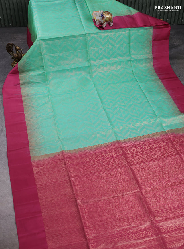 Pure soft silk saree teal green and onoion pink with allover zari woven brocade weaves and simple border