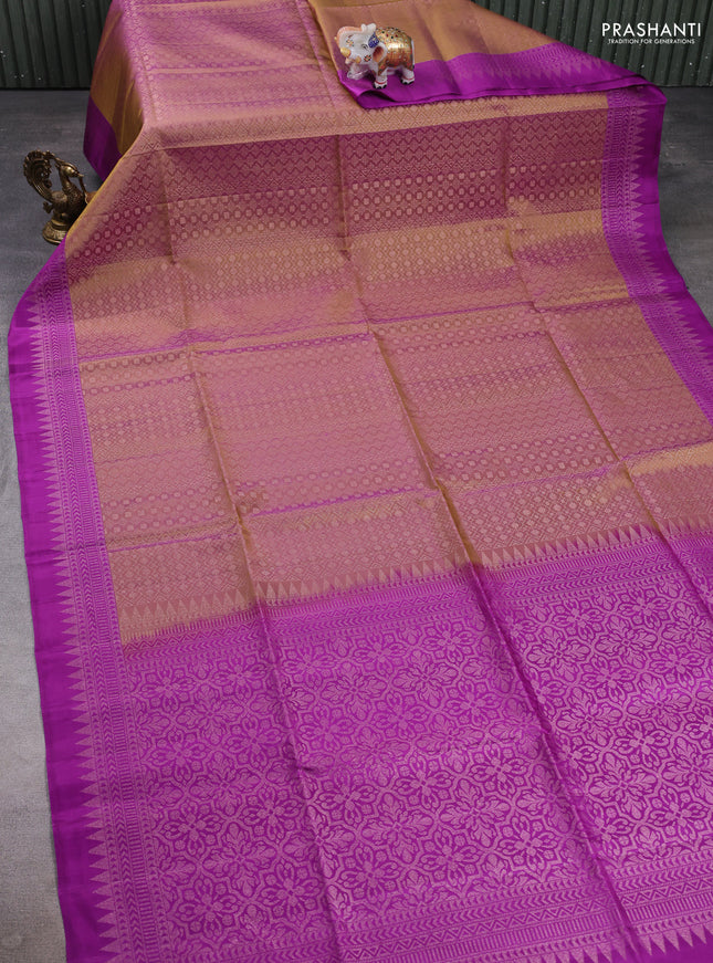 Pure soft silk saree dual shade of pastel brown and purple with allover zari woven brocade weaves and zari woven border