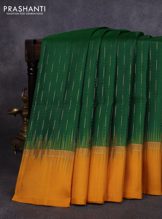 Pure soft silk saree dark green and mustard yellow with allover zari woven butta weaves and zari woven simple border