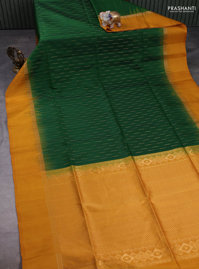 Pure soft silk saree dark green and mustard yellow with allover zari woven butta weaves and zari woven simple border