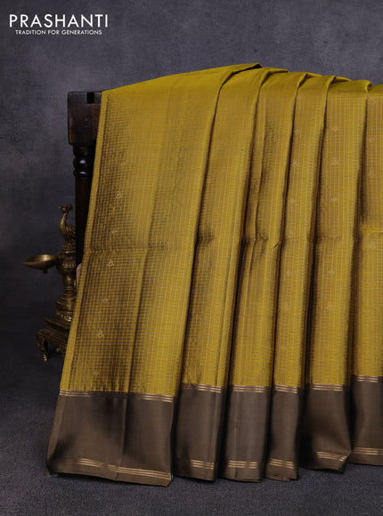 Pure soft silk saree mehendi green and datk olive green with allover small zari checks & buttas and rettapet zari woven border