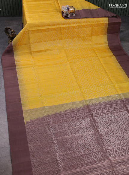 Pure soft silk saree yellow and pastel brown with allover zari woven brocade weaves and simple border