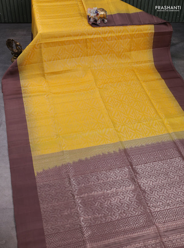 Pure soft silk saree yellow and pastel brown with allover zari woven brocade weaves and simple border
