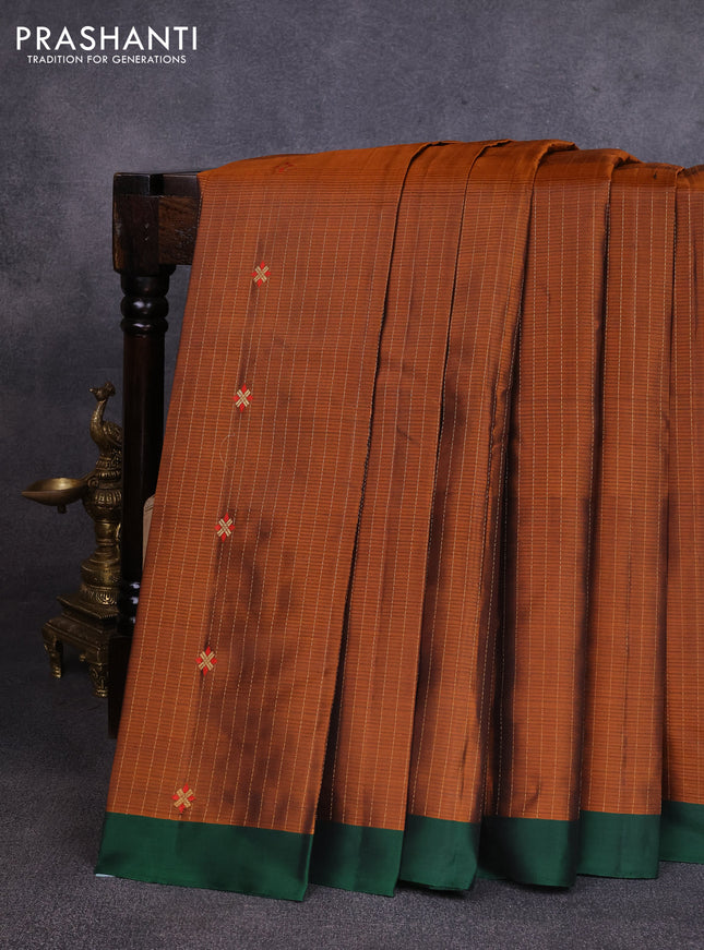 Pure soft silk saree rust shade and dark green with allover zari weaves & buttas and simple border