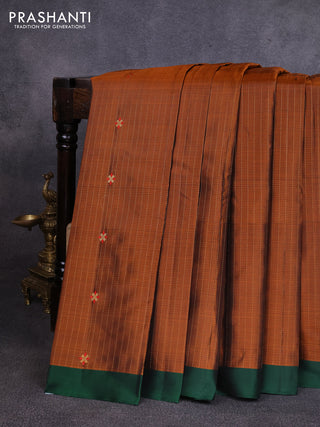 Pure soft silk saree rust shade and dark green with allover zari weaves & buttas and simple border
