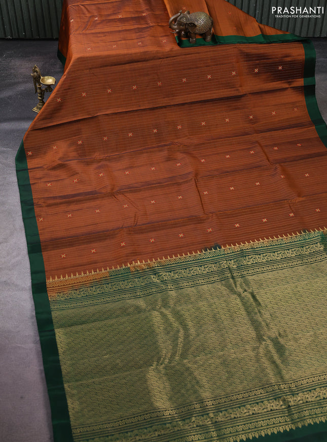 Pure soft silk saree rust shade and dark green with allover zari weaves & buttas and simple border
