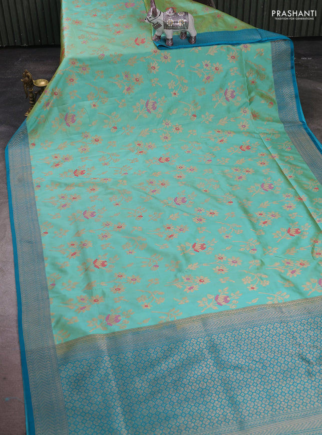 Banarasi katan silk saree dual shade of teal and cs blue with allover zari woven floral weaves and zari woven border
