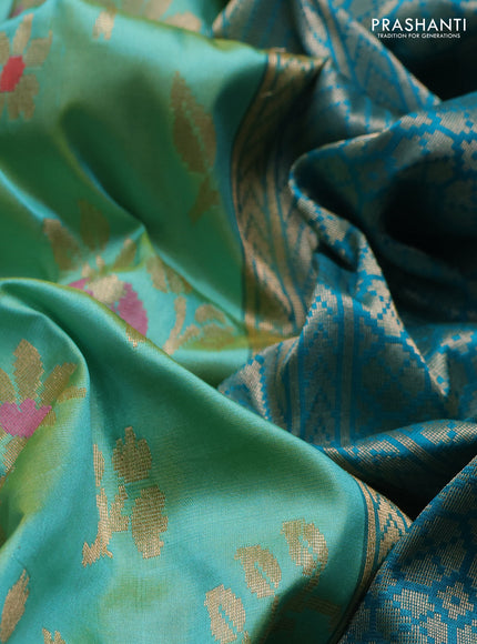 Banarasi katan silk saree dual shade of teal and cs blue with allover zari woven floral weaves and zari woven border