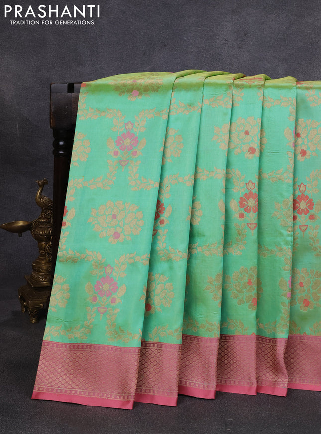 Banarasi katan silk saree teal green and peach pink with allover zari woven floral weaves and zari woven border