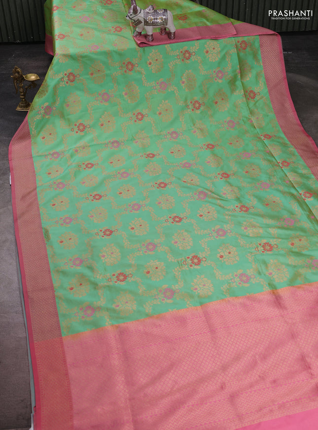 Banarasi katan silk saree teal green and peach pink with allover zari woven floral weaves and zari woven border