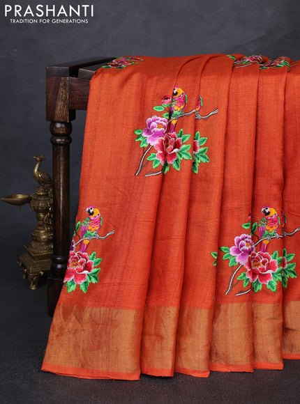 Pure tussar silk saree orange with floral embroidery buttas and zari woven border