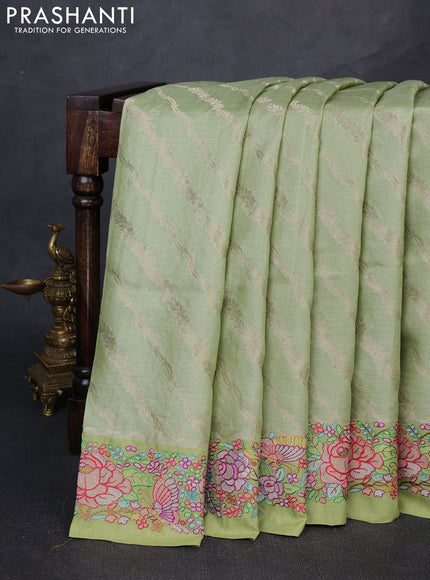 Pure tussar silk saree pastel green with allover zari weaves and embroidery border