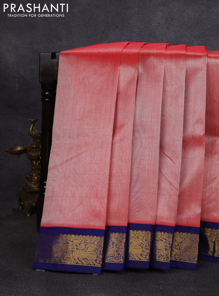 Silk cotton saree peach orange and navy blue with plain body and zari woven korvai border