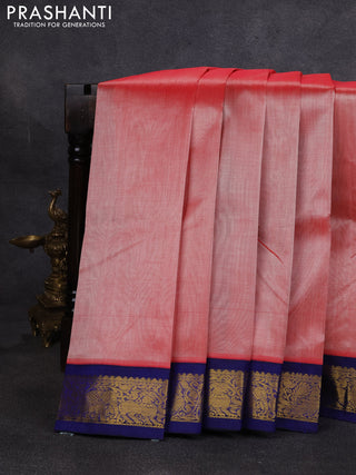 Silk cotton saree peach orange and navy blue with plain body and zari woven korvai border