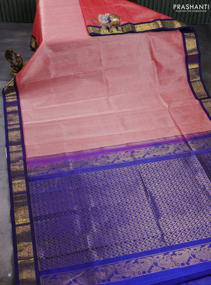 Silk cotton saree peach orange and navy blue with plain body and zari woven korvai border