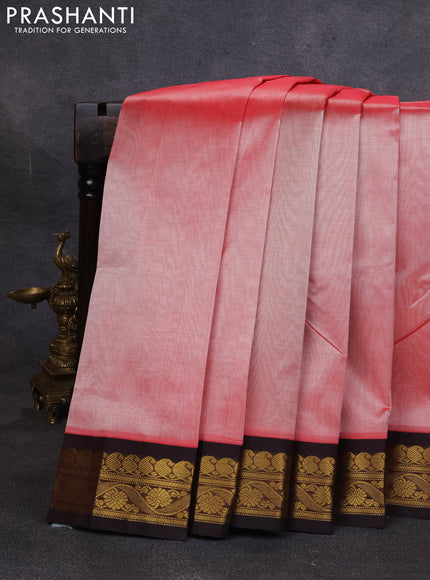 Silk cotton saree peach orange and deep maroon with plain body and zari woven korvai border