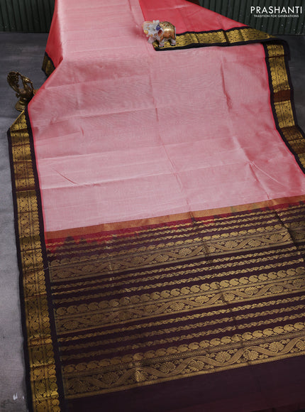 Silk cotton saree peach orange and deep maroon with plain body and zari woven korvai border