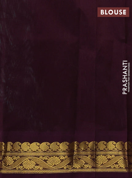 Silk cotton saree teal green and deep wine with plain body and zari woven korvai border