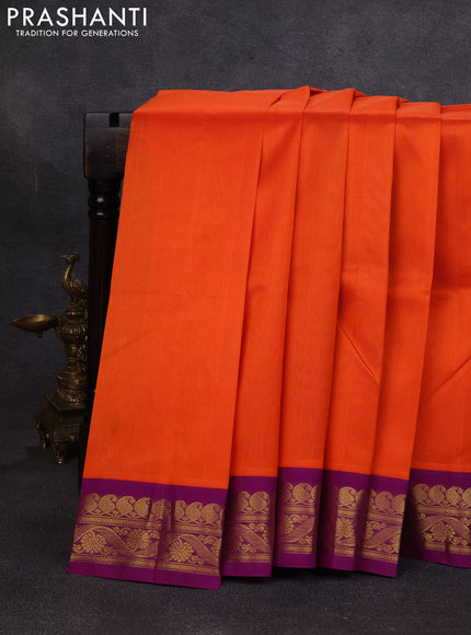 Silk cotton saree orange and purple with plain body and zari woven korvai border