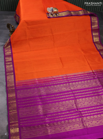 Silk cotton saree orange and purple with plain body and zari woven korvai border