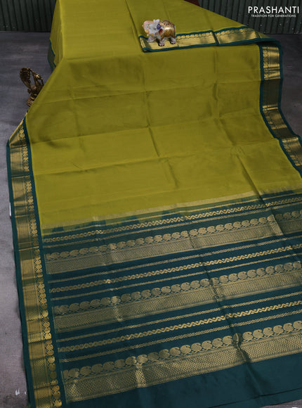 Silk cotton saree mehendi green and bottle green with plain body and zari woven korvai border