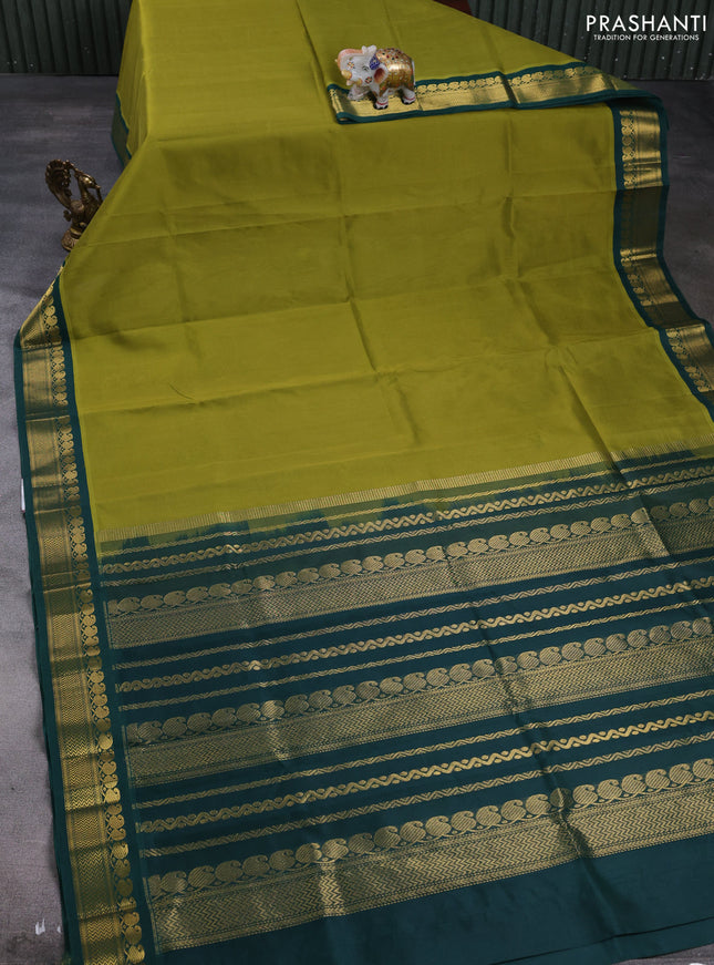 Silk cotton saree mehendi green and bottle green with plain body and zari woven korvai border
