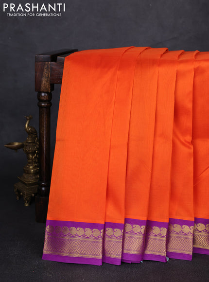Silk cotton saree orange and purple with plain body and zari woven korvai border