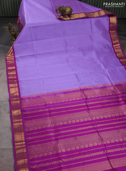 Silk cotton saree lavender and purple with plain body and zari woven korvai border