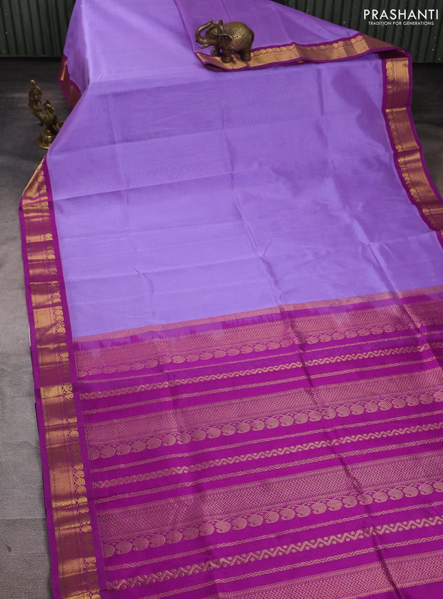 Silk cotton saree lavender and purple with plain body and zari woven korvai border