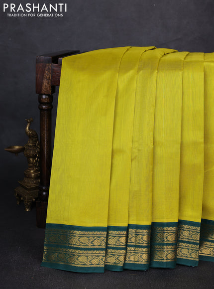 Silk cotton saree lime yellow and bottle green with plain body and zari woven korvai border