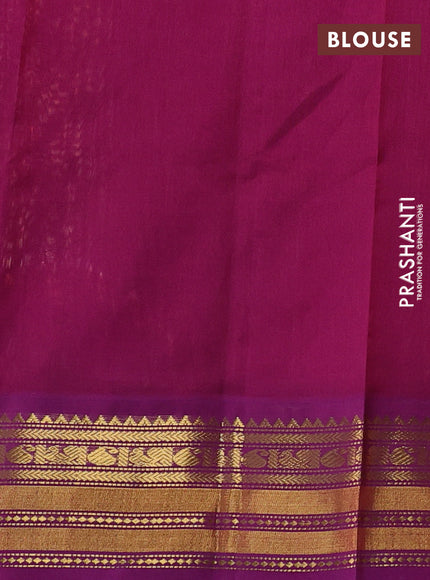 Silk cotton saree peach orange and purple with plain body and zari woven korvai border