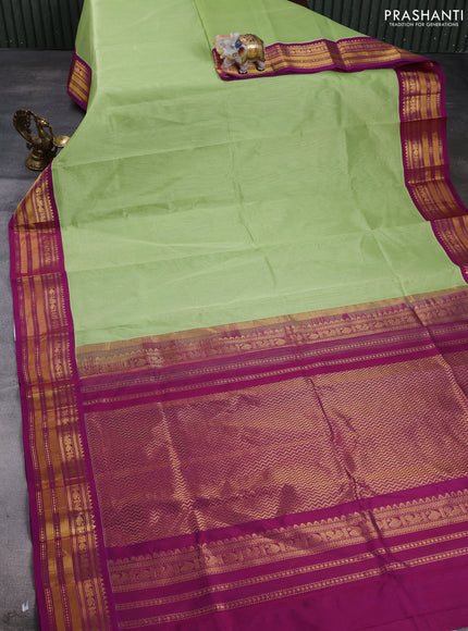 Silk cotton saree pista green and purple with plain body and zari woven korvai border