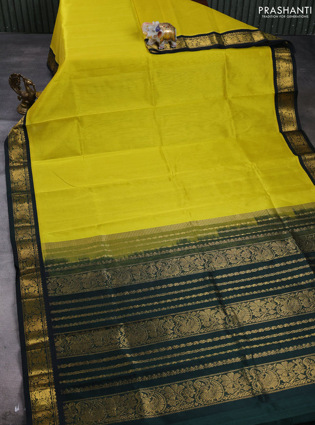 Silk cotton saree lime yellow and bottle green with plain body and paisley butta zari woven korvai border
