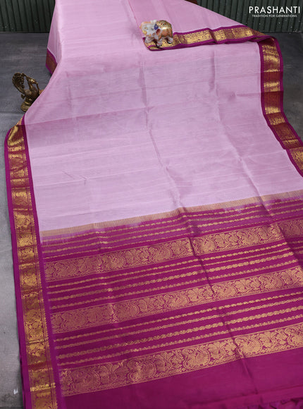 Silk cotton saree mild lavender and purple with plain body and paisley butta zari woven korvai border