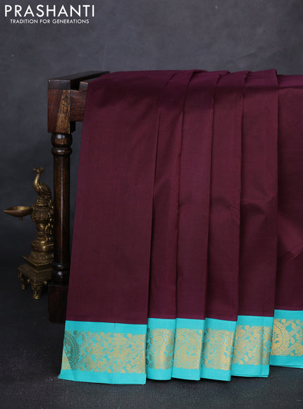 Silk cotton saree deep wine and teal green with plain body and paisley butta zari woven korvai border