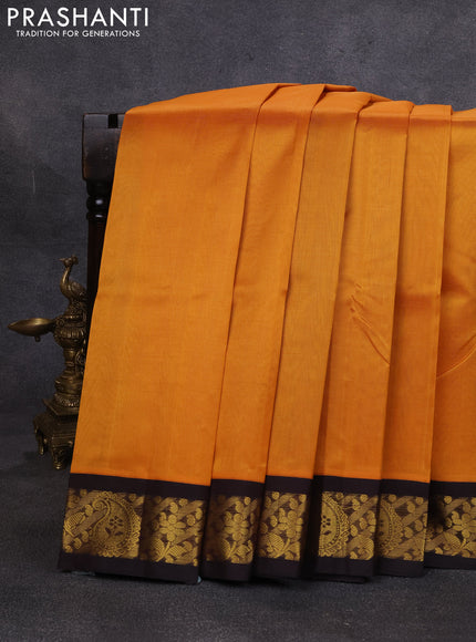 Silk cotton saree mustard yellow and coffee brown with plain body and paisley butta zari woven korvai border